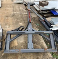 Adjustable boom pole for skid steer