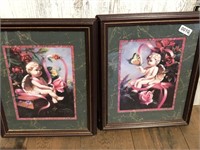 Two framed cherub prints