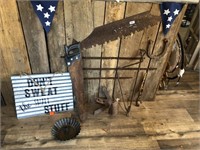 Rusty antique tools and sign