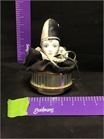 Masked top doll head music box