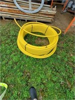 LARGE ROLL OF YELLOW HOSE
