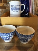 2 tea cups, 2 coffee mugs and blue glass bottle