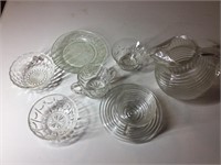 Glass pitcher, saucers, and cups