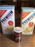2 metal saltine cracker cans and metal Calumet