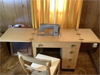 Vintage Kenmore sewing machine with attachments
