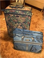 One large 2 suitcase with 2 medium carryon sized