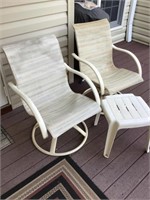 Two swivel patio chairs and table