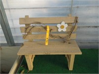 Wooden bench with daisy