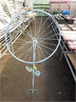 Metal bicycle wheel yard ornament