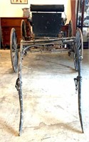 Antique Horse Drawn Buggy has wooden wheels Floors