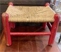 Small primitive stool with red paint