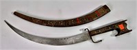 Dagger, curved blade, inlaid handle and scabbard,
