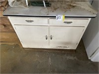 Old cabinet with white granite top