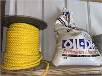 spool of rope and partial bag oil dry