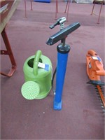 plastic watering can, tire pump