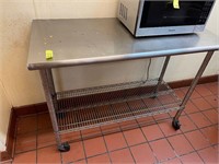 Stainless Steeled table 50”x24”x34” tall