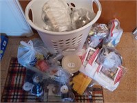 Basket with sewing assortment and kitchen curtains