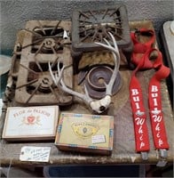 Old camping stoves antlers cigar boxes suspenders