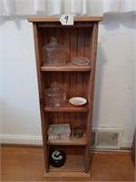 4 shelf cabinet with misc items.