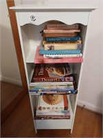 bookshelf with bottom door and book assort.