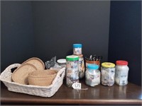 Baskets, jars of buttons and can of scissors