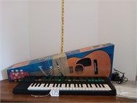 Yamaha PSS-170 keyboard and junior folk guitar