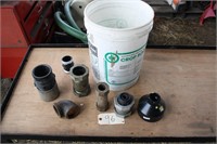 pail of pipe fittings