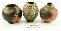 Lot #661 - (3) pottery vases (one damaged)