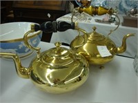 Two Victorian brass tea kettles.