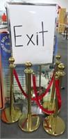 4 BRASS COLORED STANCHIONS W/VELVET ROPE AND