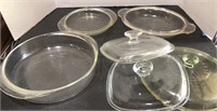 Assorted glass pyrex lids and (1) 8” Pyrex dish