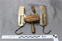 Two (2) spring scales and one (1) hand screw clamp