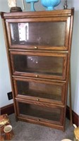 4 shelf cabinet. Glass front doors. 49.5 inches
