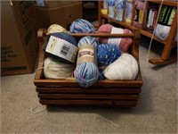 Wooden basket of yarn.