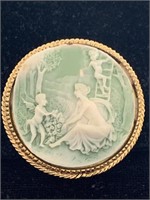 GOLD ROUND FRAMED BROOCH W/ GREEN/ WHITE CUPID