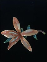 FLOWER BROOCH PIN WITH GLASS GLAZE SURFACE;  HAS