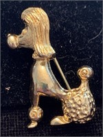 NEW VIEW GOLD POODLE BROOCH;  COSTUME JEWELRY,