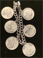 STERLING CHARM BRACELET WITH HISTORICAL COIN