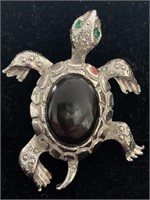 SILVER AND BLACK STONE TURTLE WITH GREEN EYES