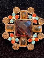 MULTICOLORED  BROOCH IN GOLD SETTING;  COSTUME