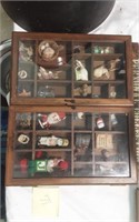 Assorted Trinkets in wood cabinet