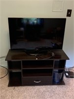 32" Flat screen TV with stand.