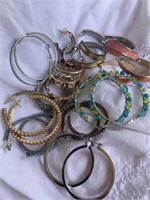 13 pairs of hoop style costume jewelry earrings