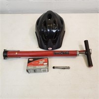 Black bicycle helmet, pump, tube & gauge