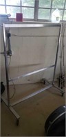 Metal rolling adjustable clothes rack 
4ft w