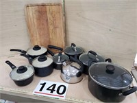 pans-worn, cutting board, tea pot