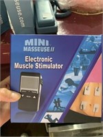 Electronic muscle stimulator mini masseuse new in