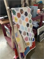 Three quilts and ladder display rack