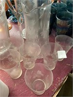 Picture with six juice glasses chip on one of the