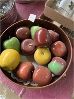 Wooden bowl with wooden apples red yellow and